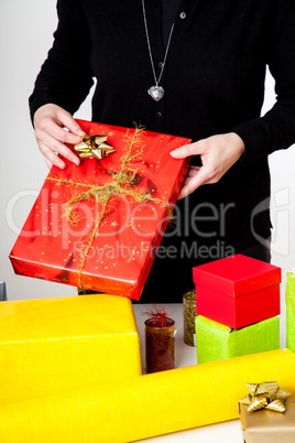 Woman bagging Christmas gifts