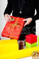 Woman bagging Christmas gifts