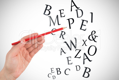Composite image of hand holding red pencil