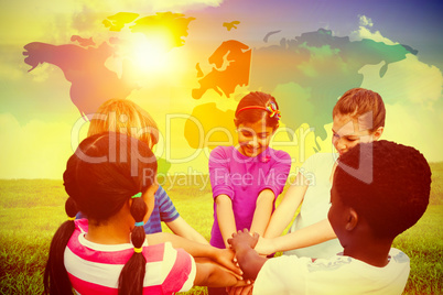 Composite image of children holding hands together at park