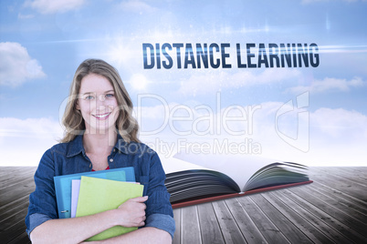 Distance learning against open book against sky