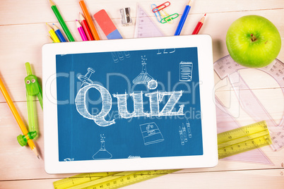 Quiz against students desk with tablet pc