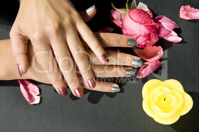 Woman manicure arranged with rose