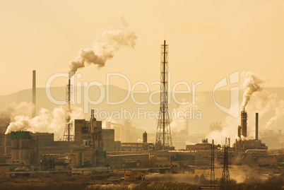 Industrial city with chimneys an refinery
