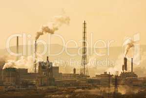 Industrial city with chimneys an refinery