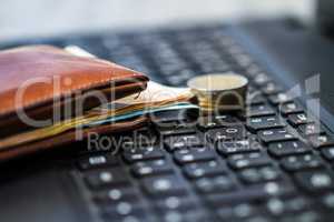 Wallet and money on keyboard