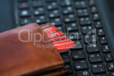 Wallet and card on keyboard