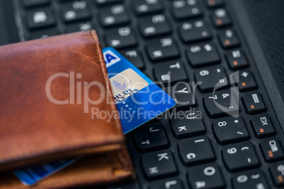 Wallet and card on keyboard