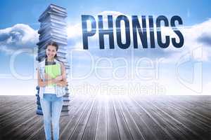 Phonics against stack of books against sky