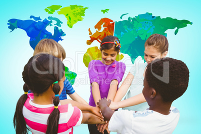 Composite image of children holding hands together at park