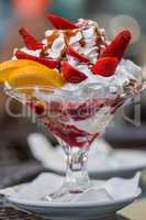 Delicious vanilla sundae with strawberry