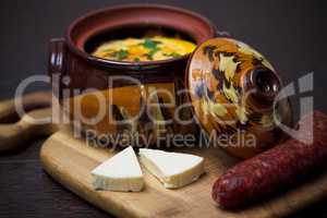 Stew pot with sausage and cheese