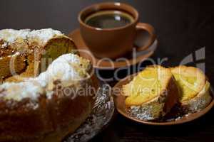 Round cake with sugar top and coffee. Traditional cuisine.