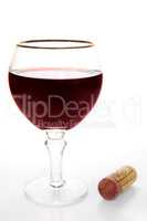 Glass of red wine and cork