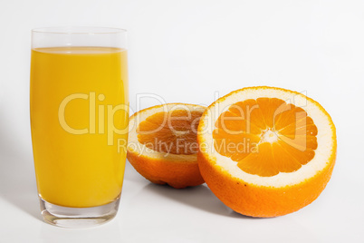 Orange with glass of orange juice isolated