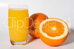 Orange with glass of orange juice isolated