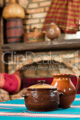 Old village tavern. Rural interior of table with cup of gourmet meal and blur background.