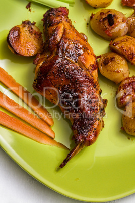 Roasted rabbit leg and vegetables