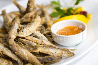 Fried sprat with souce