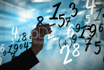 Composite image of hand holding a chalk and writing something