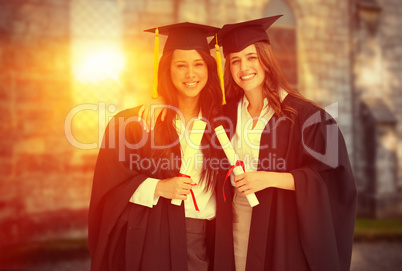 Composite image of two women embracing each other after they gra