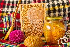 Jars of honey and honeycomb. Honey products