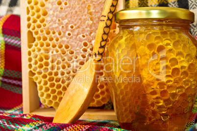 Jars of honey and honeycomb. Honey products