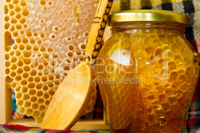 Jars of honey and honeycomb. Honey products