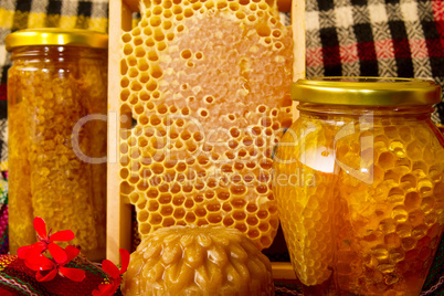 Jars of honey and honeycomb. Honey products