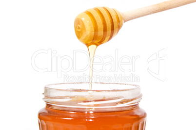 Stick with honey isolated on white