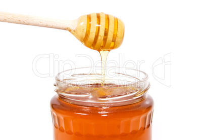 Stick with honey isolated on white