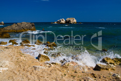 Empty beach with rock islands