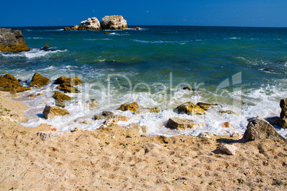 Empty beach with rock islands