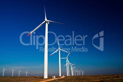 Wind power generators on blue sky