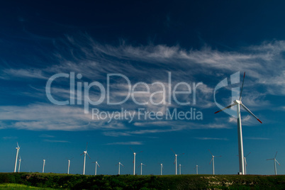 Wind power generators on blue sky