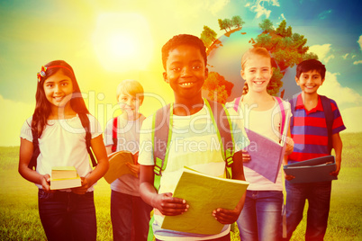 Composite image of smiling little school kids in school corridor