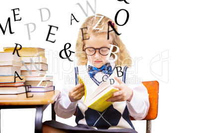 Composite image of blonde pupil reading a book