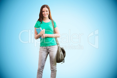 Composite image of student smiling at camera in library