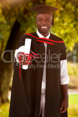 Composite image of man smilling at graduation