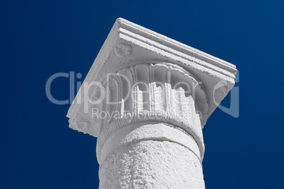 White column and capital against the dark blue sky