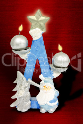 Christmas candles on red background