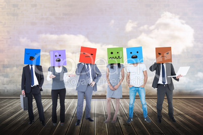 Composite image of people with boxes on their heads