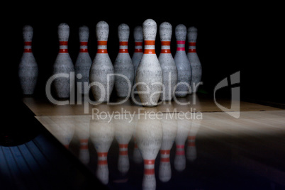 Bowling pins on wooden lane