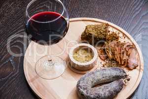 Meat fillet sausage and red wine