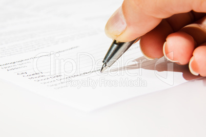 Signing contract closeup. Agreement with woman hand.