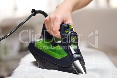 Woman ironing laundry