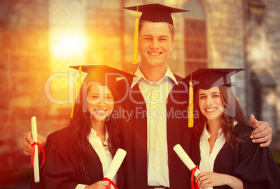 Composite image of three friends graduate from college together