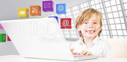 Composite image of cute boy using laptop