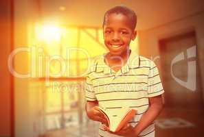 Composite image of happy pupil with book
