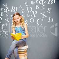 Composite image of cute little girl reading book in library